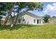 Home exterior with sliding glass door and green grass lawn at 841 Wesson Ct, Casselberry, FL 32707