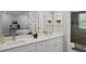 Bathroom with double vanity, framed mirrors, white cabinetry and a shower room at 841 Wesson Ct, Casselberry, FL 32707