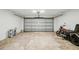 Spacious garage featuring an overhead door, concrete floor, and ample room for parking or storage at 841 Wesson Ct, Casselberry, FL 32707