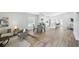 Spacious living area showcases a seamless flow between living, dining, and kitchen spaces, perfect for entertaining at 841 Wesson Ct, Casselberry, FL 32707