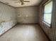 Bedroom featuring tile floor, window, and unique wall coverings at 4250 Lake Ave, Kissimmee, FL 34746