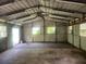 View of the interior of the spacious garage featuring large windows and ceiling fan at 4250 Lake Ave, Kissimmee, FL 34746