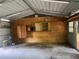 Spacious garage featuring shelving, cabinets, and an abundance of storage options at 4250 Lake Ave, Kissimmee, FL 34746