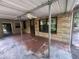 Covered patio features brick walls, a ceiling fan, and access to the backyard at 4250 Lake Ave, Kissimmee, FL 34746