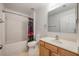 Bright bathroom featuring a sink, vanity, toilet, and shower/tub combo at 100 Monterey Oaks Dr, Sanford, FL 32771