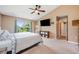 Bedroom featuring vaulted ceilings, ceiling fan, and a large window for natural light at 100 Monterey Oaks Dr, Sanford, FL 32771
