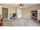 Neutral bedroom featuring ceiling fan, carpeting, closet, and a desk near the entry door at 100 Monterey Oaks Dr, Sanford, FL 32771