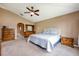 Bedroom with vaulted ceiling featuring a bed, dresser, and ample closet space at 100 Monterey Oaks Dr, Sanford, FL 32771