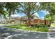 Street view of Monterey Oaks community entrance sign with mature trees in view at 100 Monterey Oaks Dr, Sanford, FL 32771