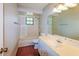 Bright bathroom featuring a tub/shower combo, tiled floors, and a vanity with storage at 10448 Sw 74Th Ct, Ocala, FL 34476