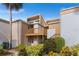 Condo featuring a private balcony, beautiful landscaping, and a serene atmosphere for comfortable living at 1051 S Highland St # 7D, Mount Dora, FL 32757