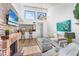 Living room with fireplace, bar seating to kitchen, and comfortable seating at 1051 S Highland St # 7D, Mount Dora, FL 32757