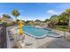 Community pool area with lounge chairs and umbrellas, perfect for relaxation and enjoying the Florida sunshine at 1051 S Highland St # 7D, Mount Dora, FL 32757