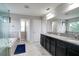 Elegant bathroom with double sinks, granite countertops, a large mirror and separate shower and bath at 14460 Orchard Hills Blvd, Winter Garden, FL 34787