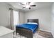 Bedroom featuring a large bed with blue bedding and a window with light at 14460 Orchard Hills Blvd, Winter Garden, FL 34787