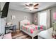 Cute bedroom featuring a bed, desk, and charming decor and plenty of light at 14460 Orchard Hills Blvd, Winter Garden, FL 34787