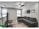 Bonus room with a ceiling fan, wood-look flooring, and a gray sofa at 14460 Orchard Hills Blvd, Winter Garden, FL 34787