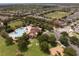 Community aerial view with pool, clubhouse, playground and surrounding residential area at 14460 Orchard Hills Blvd, Winter Garden, FL 34787