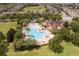 Aerial view of a community pool featuring a freeform design and landscaped surroundings at 14460 Orchard Hills Blvd, Winter Garden, FL 34787