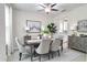 Bright dining room featuring modern table, chairs, artwork, and decor at 14460 Orchard Hills Blvd, Winter Garden, FL 34787