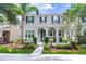 Charming two-story home with landscaped yard and covered front porch, perfect for enjoying the outdoors at 14460 Orchard Hills Blvd, Winter Garden, FL 34787