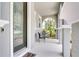 Inviting front porch with decorative door, chairs, and a serene outdoor space at 14460 Orchard Hills Blvd, Winter Garden, FL 34787