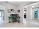 Open hallway features tile flooring, neutral walls, and leads to various rooms at 14460 Orchard Hills Blvd, Winter Garden, FL 34787