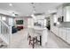 Open-concept kitchen with a center island, tile floors, stainless steel appliances and easy access to living room at 14460 Orchard Hills Blvd, Winter Garden, FL 34787