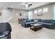 Spacious living room featuring tile floors, a ceiling fan, and plenty of natural light at 14460 Orchard Hills Blvd, Winter Garden, FL 34787