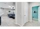 View of the living room and bathroom, open concept featuring modern decor, tile floors, and neutral paint at 14460 Orchard Hills Blvd, Winter Garden, FL 34787