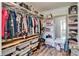 Organized walk-in closet with shelves, drawers, and hanging space for optimal storage at 14460 Orchard Hills Blvd, Winter Garden, FL 34787