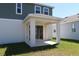 View of the covered patio with access to the backyard of this beautiful two-story home at 14568 Crestavista Ave, Clermont, FL 34714