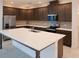 Modern kitchen featuring a large quartz island, stainless steel appliances, and stylish cabinets at 14568 Crestavista Ave, Clermont, FL 34714