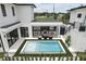 Aerial view featuring a modern home, a pool, outdoor kitchen, and manicured landscaping in backyard at 1733 Harmon Ave, Winter Park, FL 32789