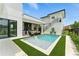 Backyard with pool, outdoor kitchen, and stairs to a possible apartment or guest suite at 1733 Harmon Ave, Winter Park, FL 32789
