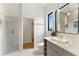 Modern bathroom with sleek vanity, vessel sink, and glass-enclosed shower, showcasing contemporary design at 1733 Harmon Ave, Winter Park, FL 32789