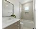 Modern bathroom featuring a sleek vanity, contemporary lighting, and a shower-tub combo at 1733 Harmon Ave, Winter Park, FL 32789