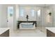 Luxurious bathroom with a glass enclosed shower and a modern soaking tub at 1733 Harmon Ave, Winter Park, FL 32789