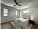 Minimalist bedroom with a modern bed frame, hardwood floors, and ample natural light at 1733 Harmon Ave, Winter Park, FL 32789