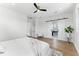 Bedroom featuring hardwood floors, sliding doors, and access to a spa-like bathroom at 1733 Harmon Ave, Winter Park, FL 32789