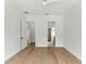 Neutral bedroom with light hardwood floors, modern ceiling fan, and ensuite bath at 1733 Harmon Ave, Winter Park, FL 32789