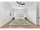 Bright bedroom with neutral colors, modern ceiling fan, and hardwood floors at 1733 Harmon Ave, Winter Park, FL 32789