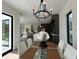 Open concept dining area with view of the living room and modern kitchen at 1733 Harmon Ave, Winter Park, FL 32789
