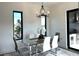 Bright dining area featuring a modern chandelier and adjacent views of kitchen and exterior landscape at 1733 Harmon Ave, Winter Park, FL 32789