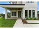 Modern home highlighting the porch, landscaping, and a minimalist front door design at 1733 Harmon Ave, Winter Park, FL 32789