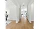 Bright, open hallway featuring hardwood floors and modern white walls at 1733 Harmon Ave, Winter Park, FL 32789
