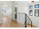 Upstairs hallway showcasing modern design and access to bedrooms and living spaces at 1733 Harmon Ave, Winter Park, FL 32789