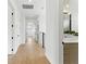 Bright hallway with a view of the staircase and a half-bathroom at 1733 Harmon Ave, Winter Park, FL 32789