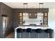 Modern kitchen with sleek cabinetry, stainless steel appliances, and a large center island with bar seating at 1733 Harmon Ave, Winter Park, FL 32789