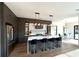 Modern kitchen featuring a large island, stainless steel appliances, and stylish pendant lighting at 1733 Harmon Ave, Winter Park, FL 32789